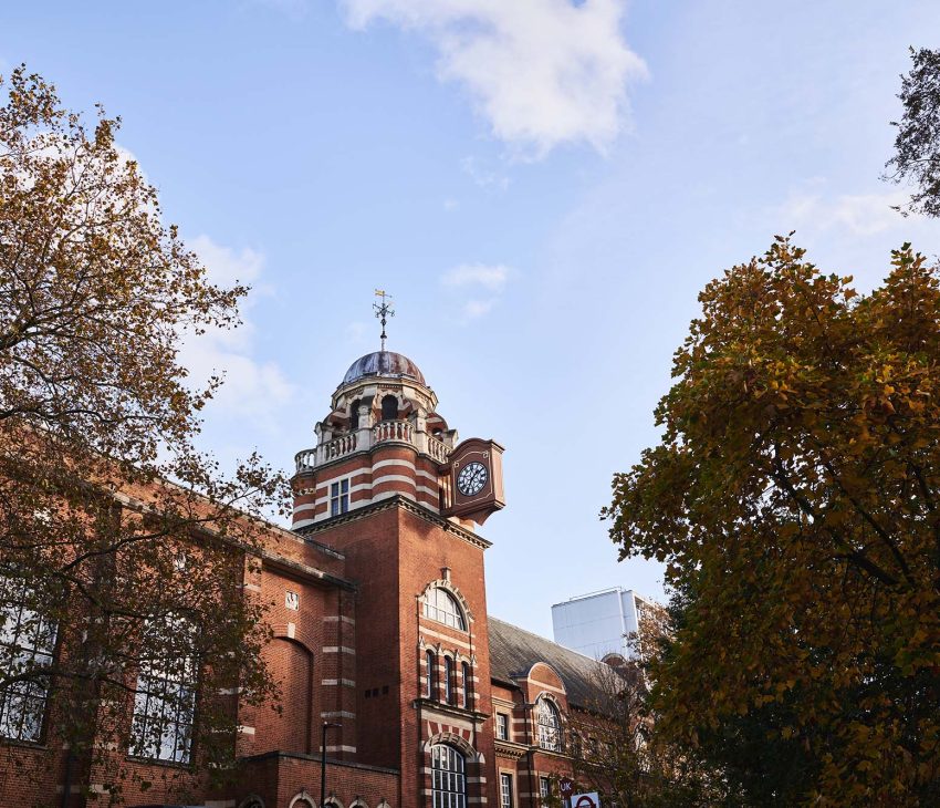 large brick building with clock