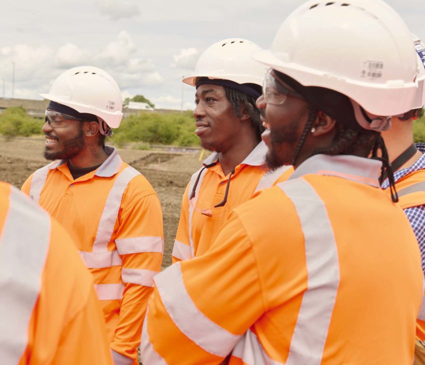 men wearing high vis jackets on a construction site