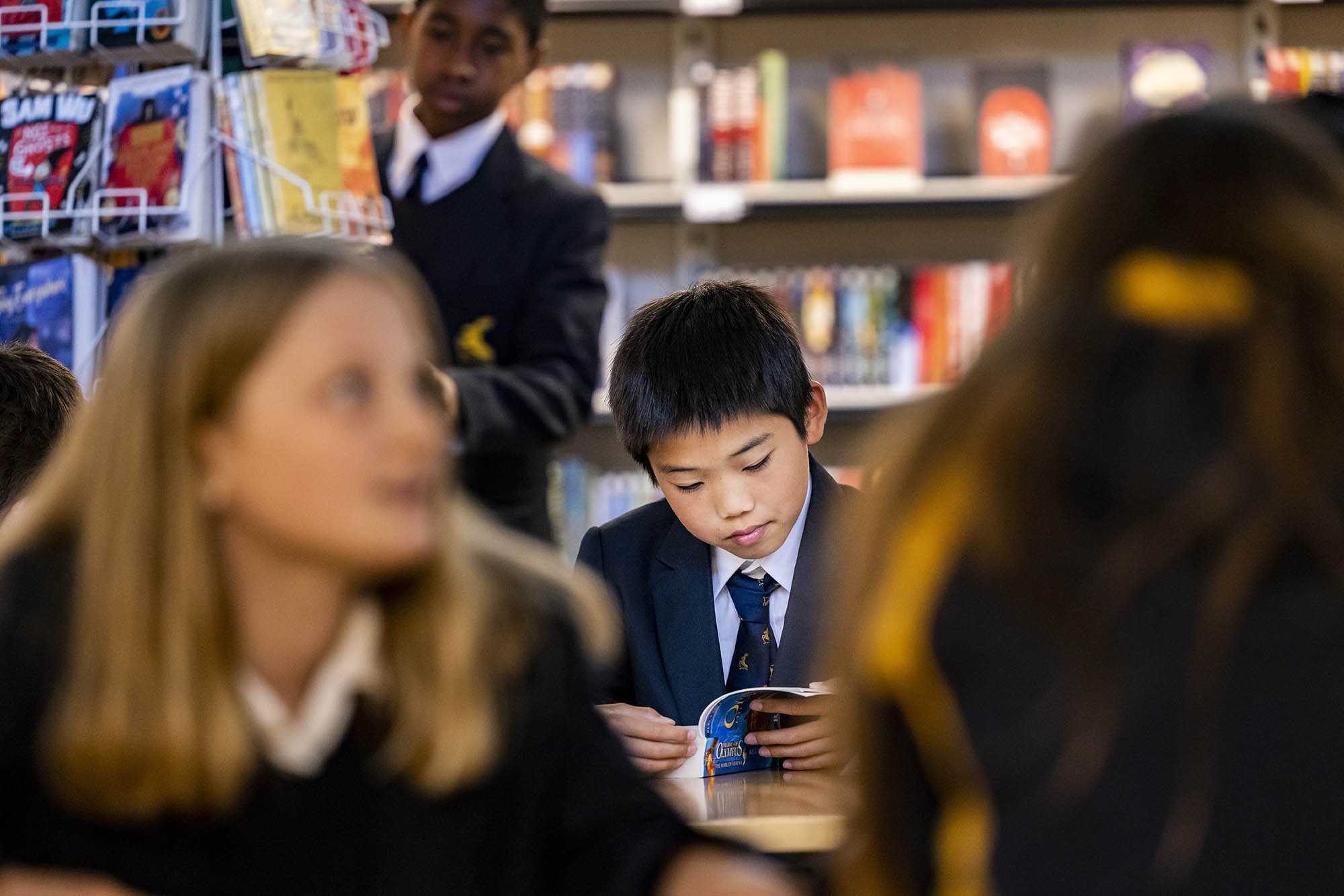 schoolchild reading a book