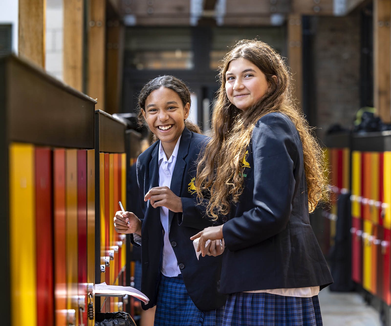 two girls by lockers laughing