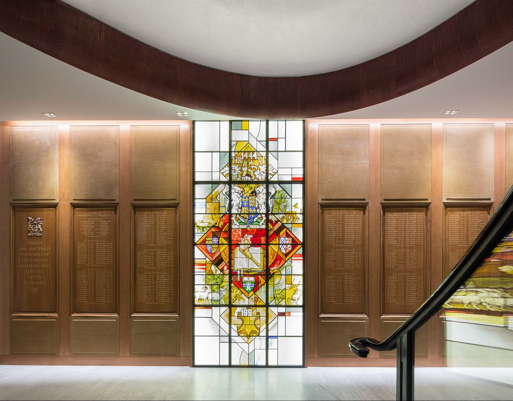 a staircase leading to a stained glass window
