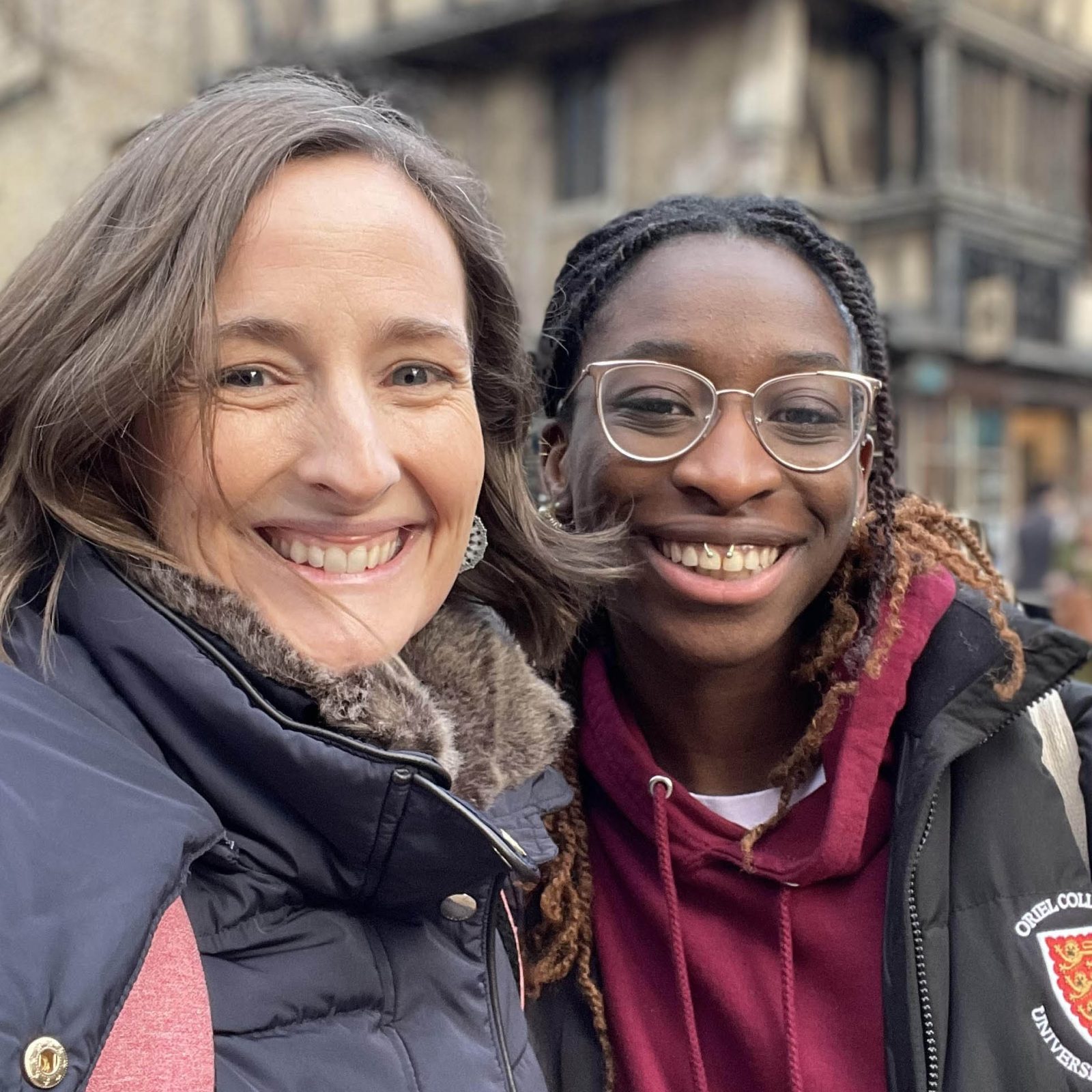 a woman and girl smiling to camera