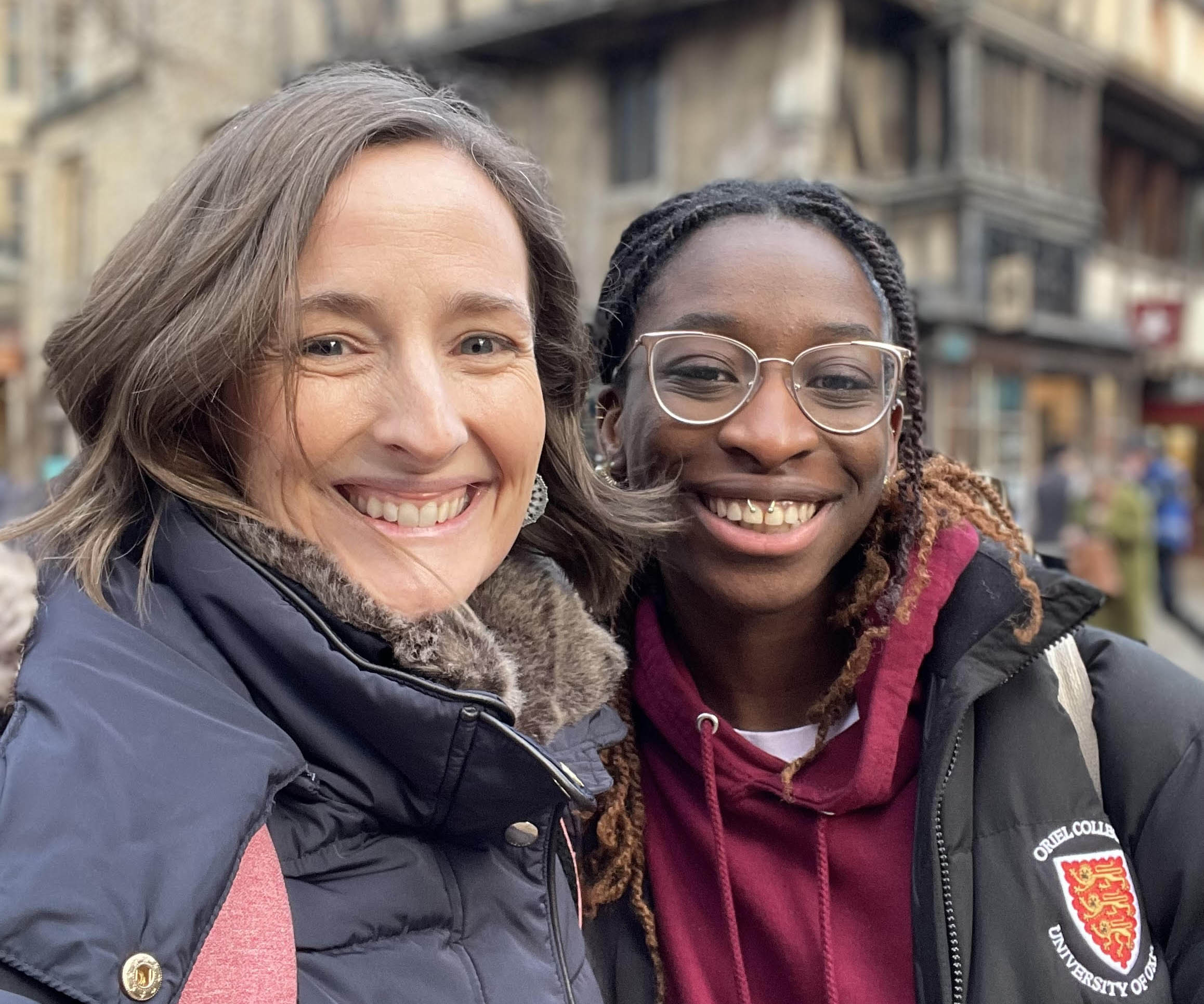 a woman and girl smiling to camera