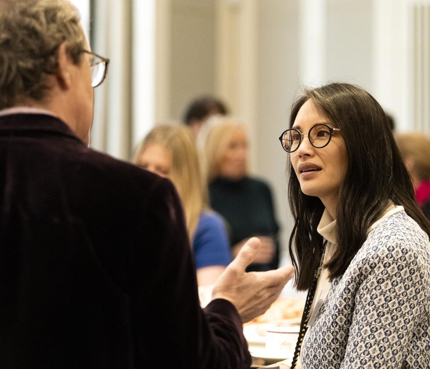man talking to a woman at an event