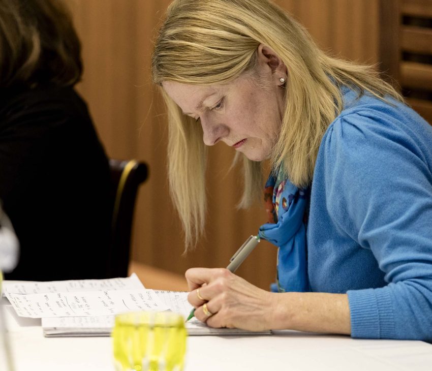 woman taking notes