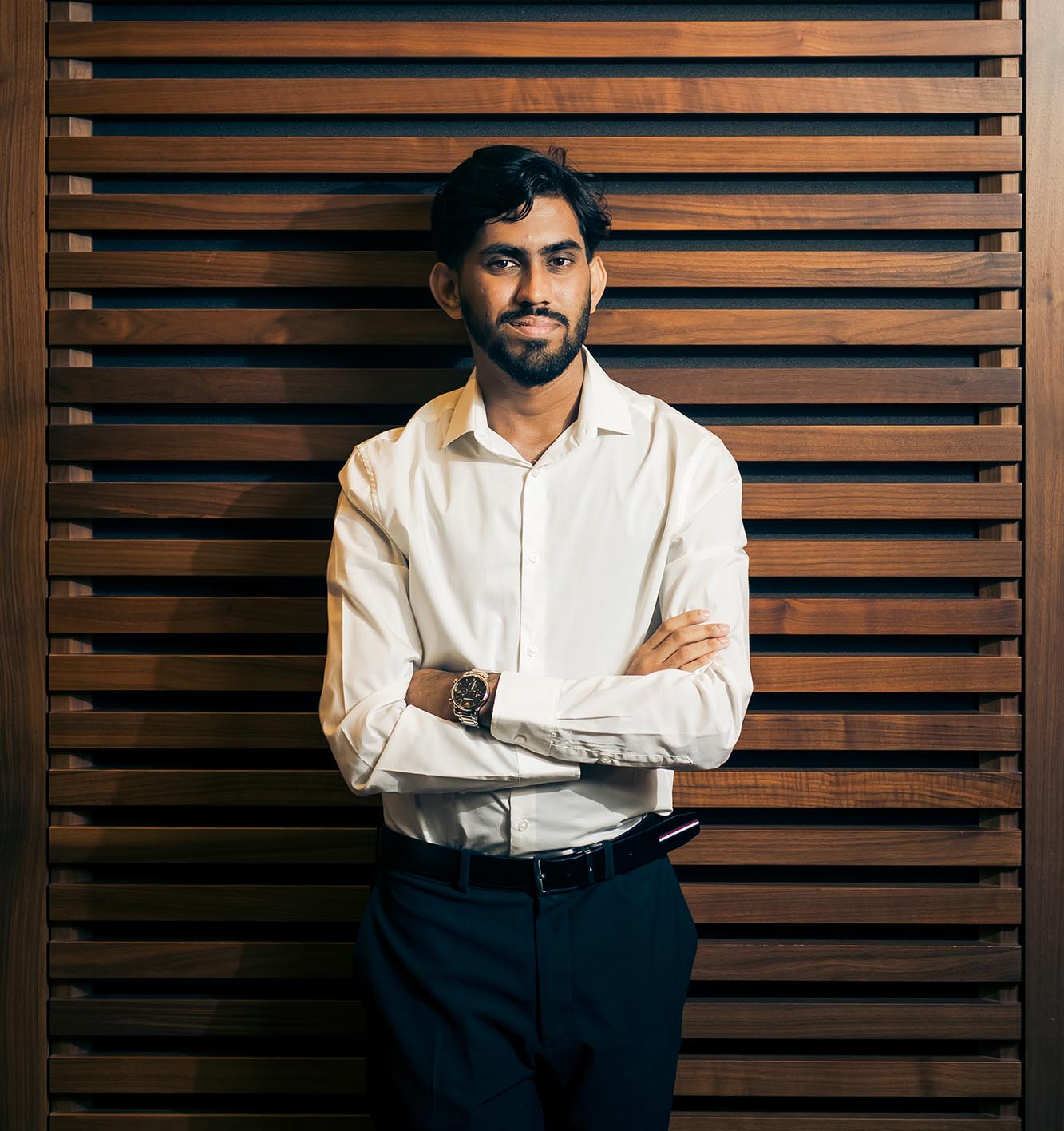 portrait of a man with a wooden background