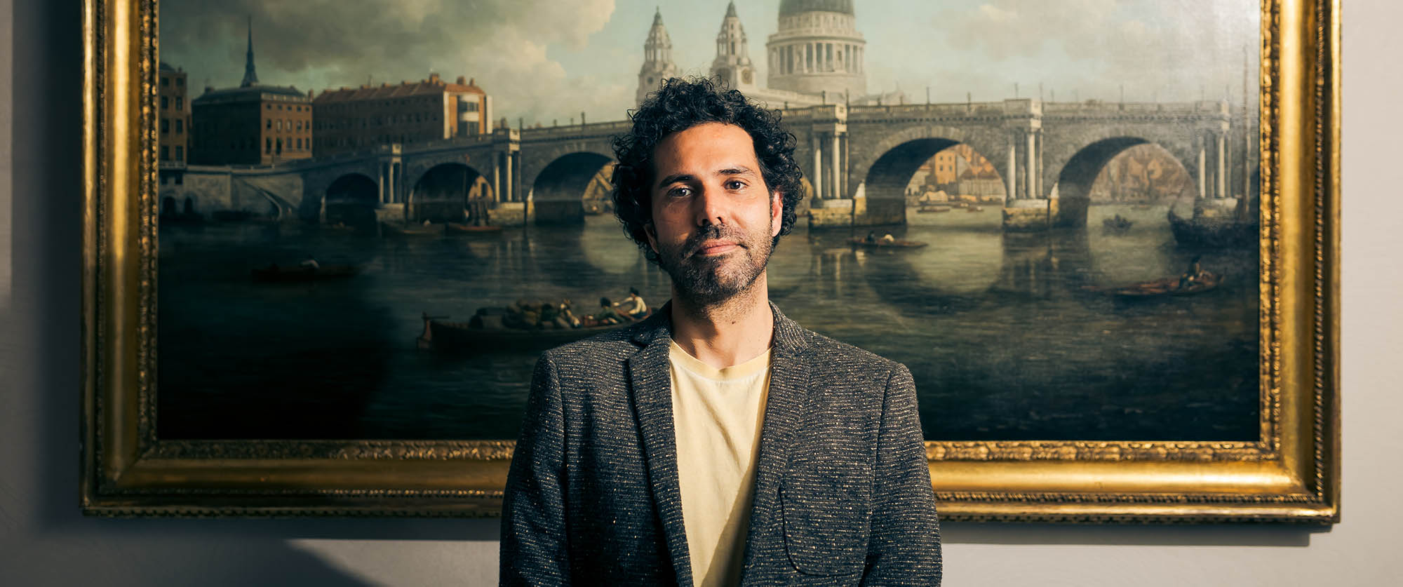man standing in front of portrait