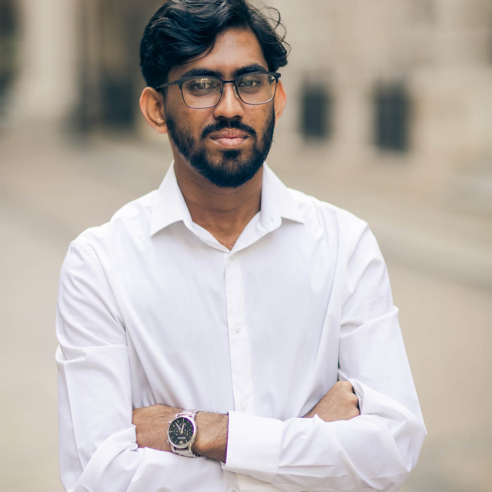 man with a white shirt and glasses