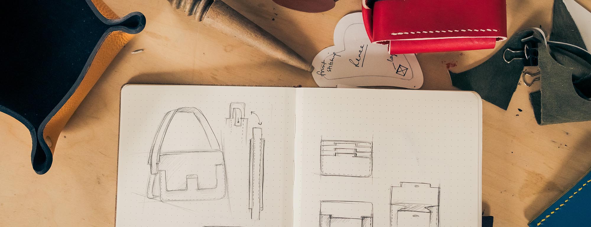 sketch book and leather items