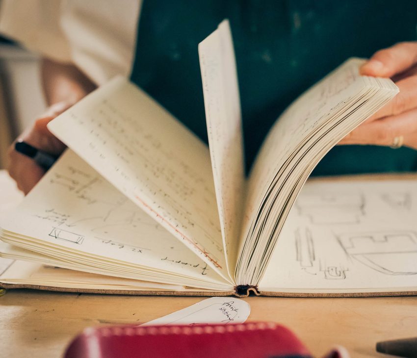 woman flicking through the pages of a book