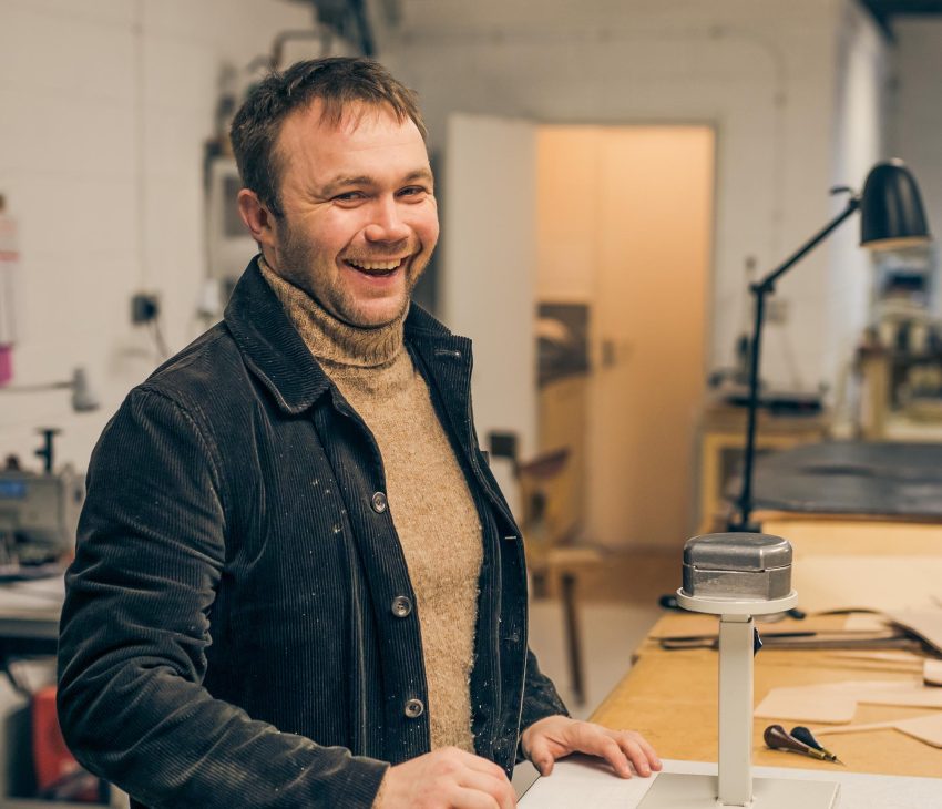 man in a studio laughing