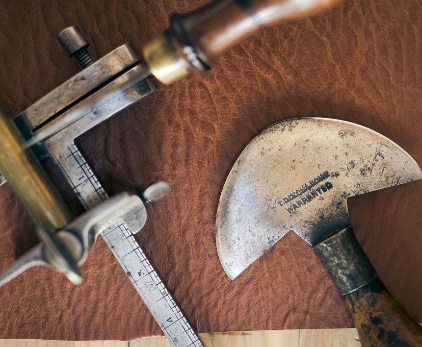 leatherworking tools on a piece of leather