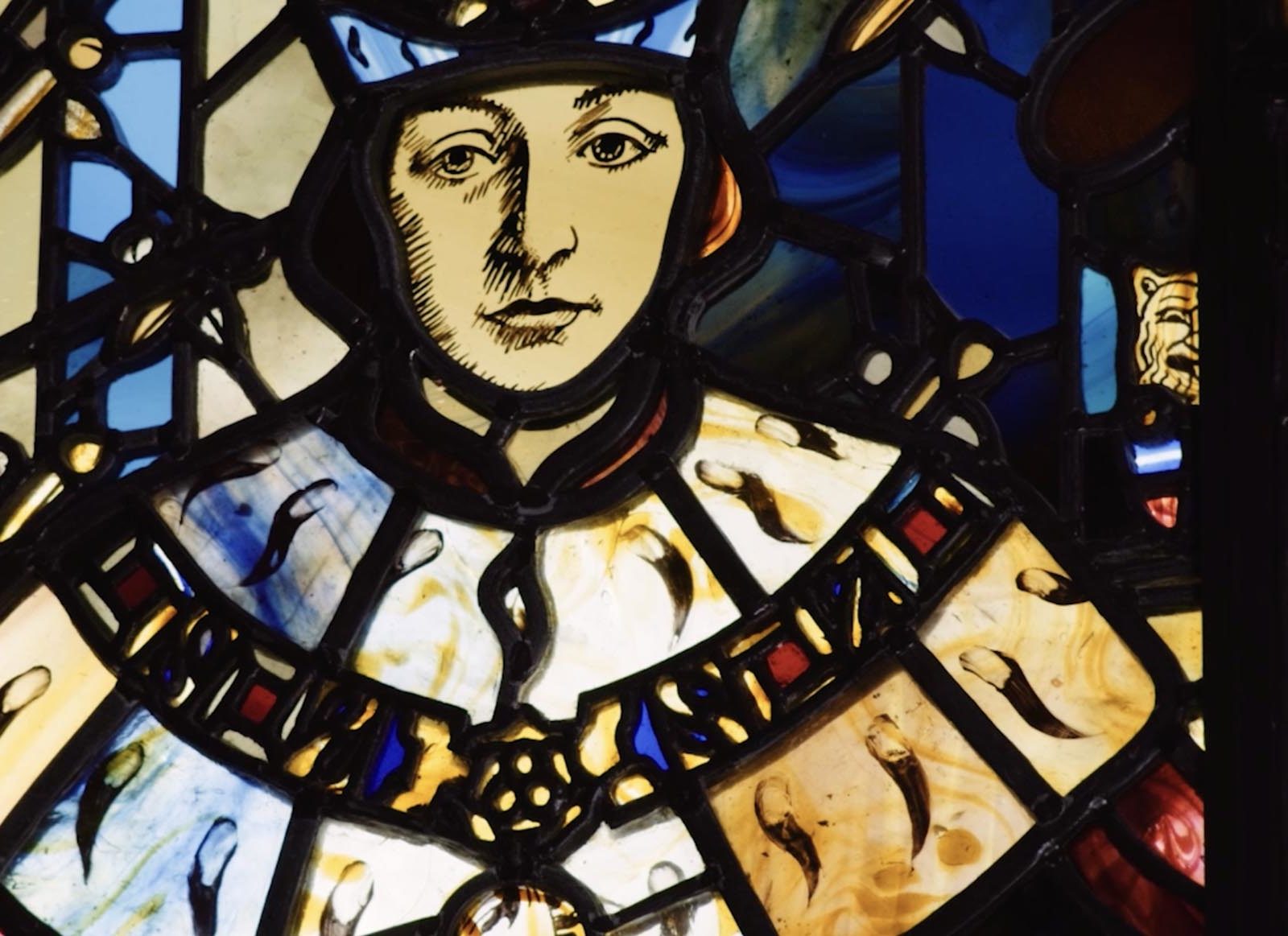 stained glass window depicting a king