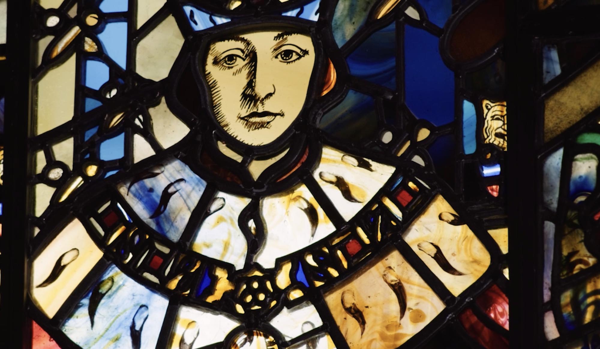 stained glass window depicting a king