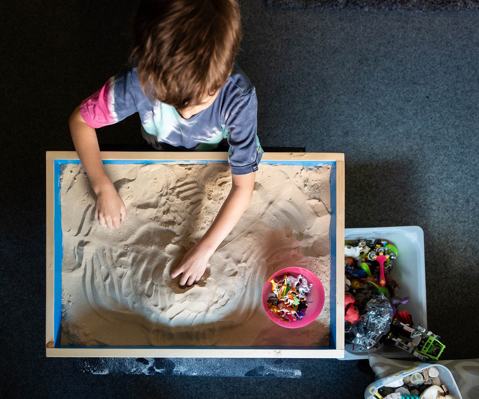 boy playing in sandpit