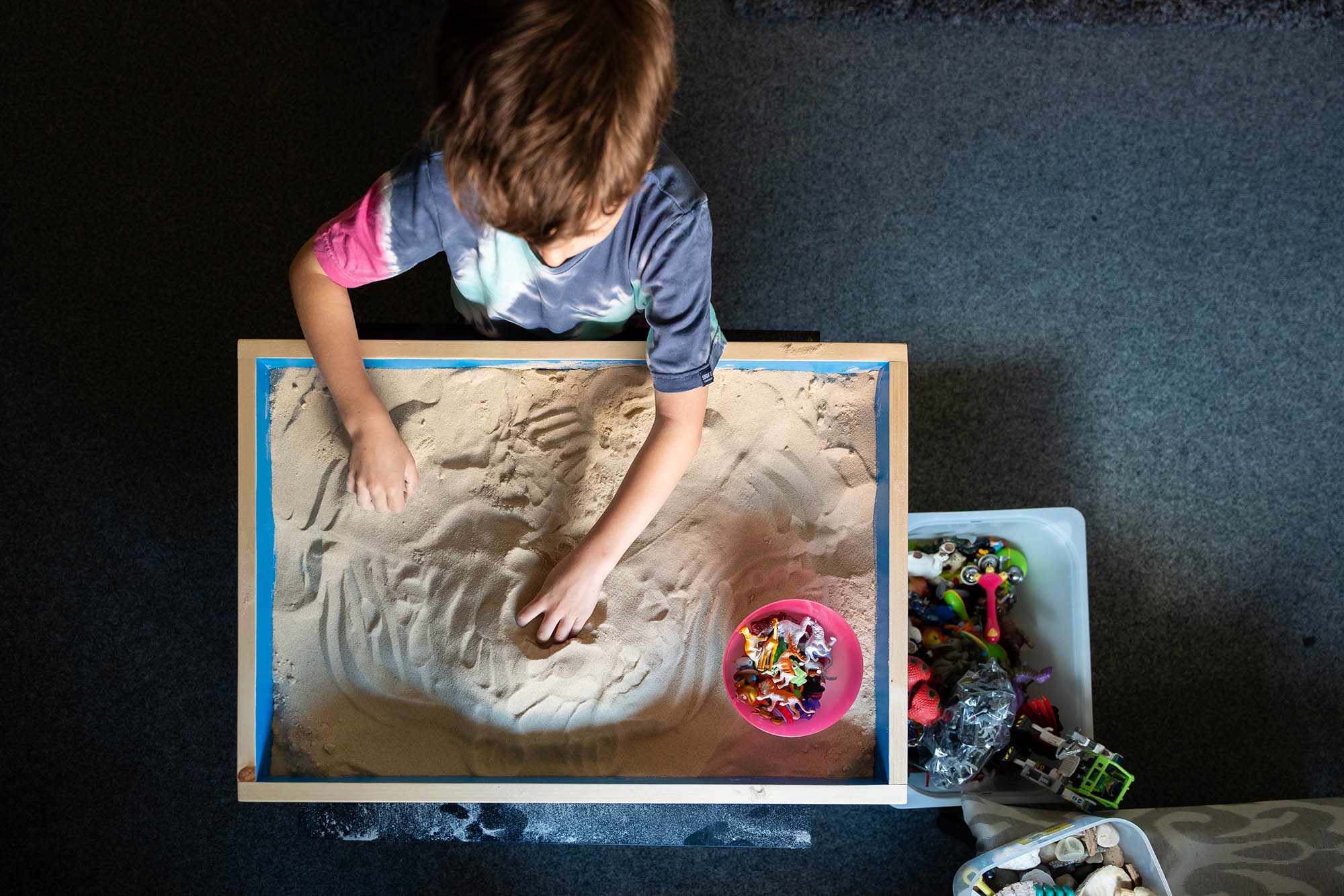 boy playing in sandpit