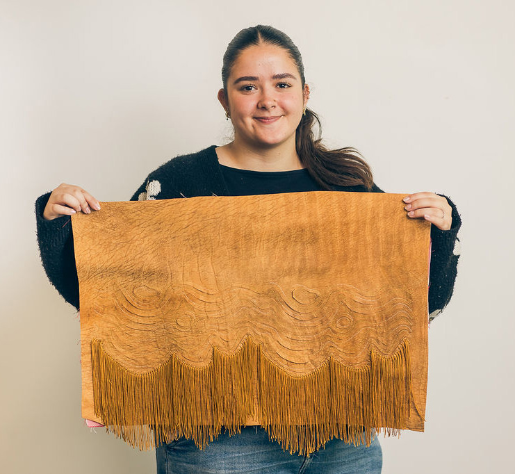 woman holding leather sample