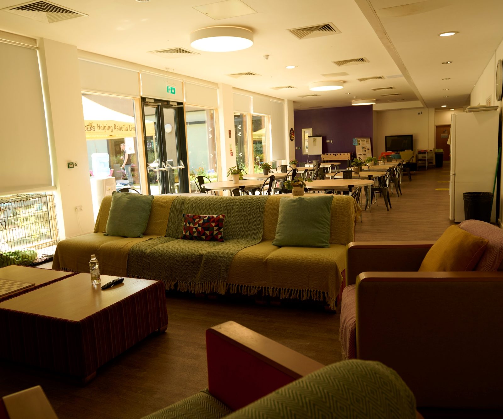 Inside of DENS, showing sofas and tables