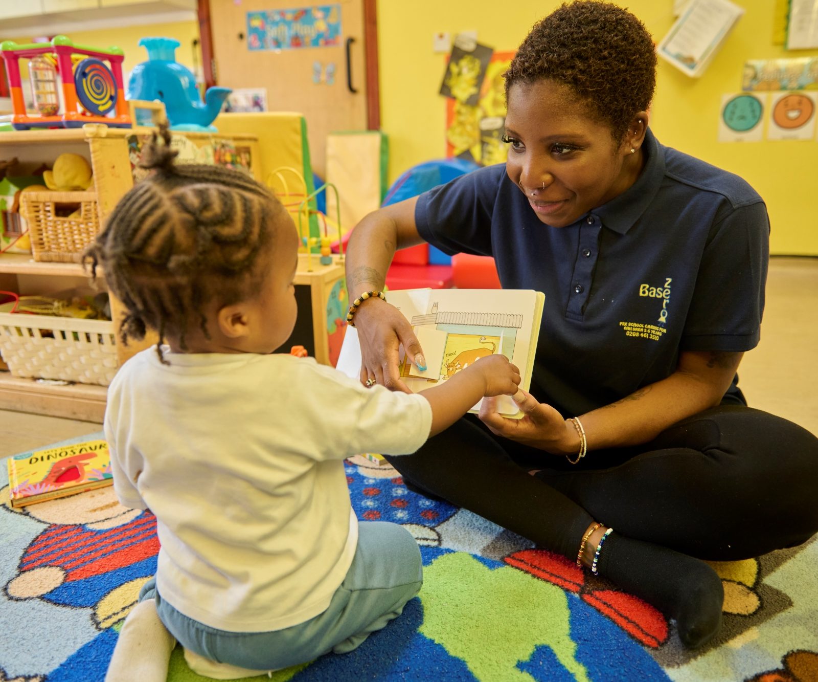 Child plays with volunteer