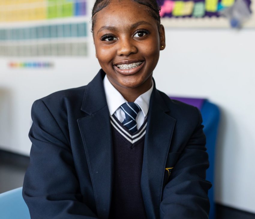 Student smiling into camera