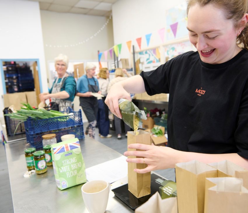 Person filling bags with rice