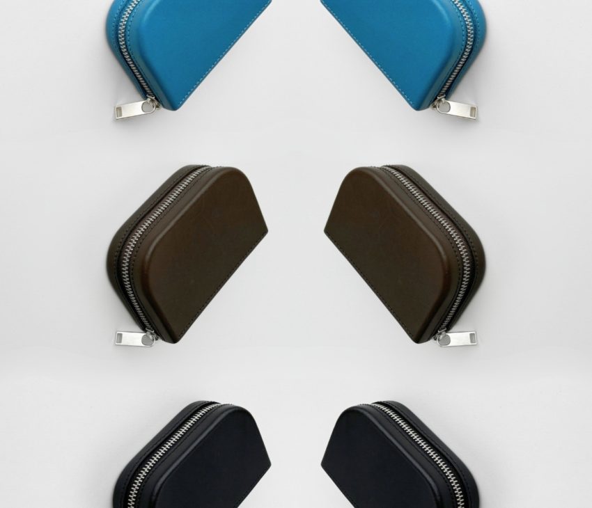 a series of blue and black leather bags