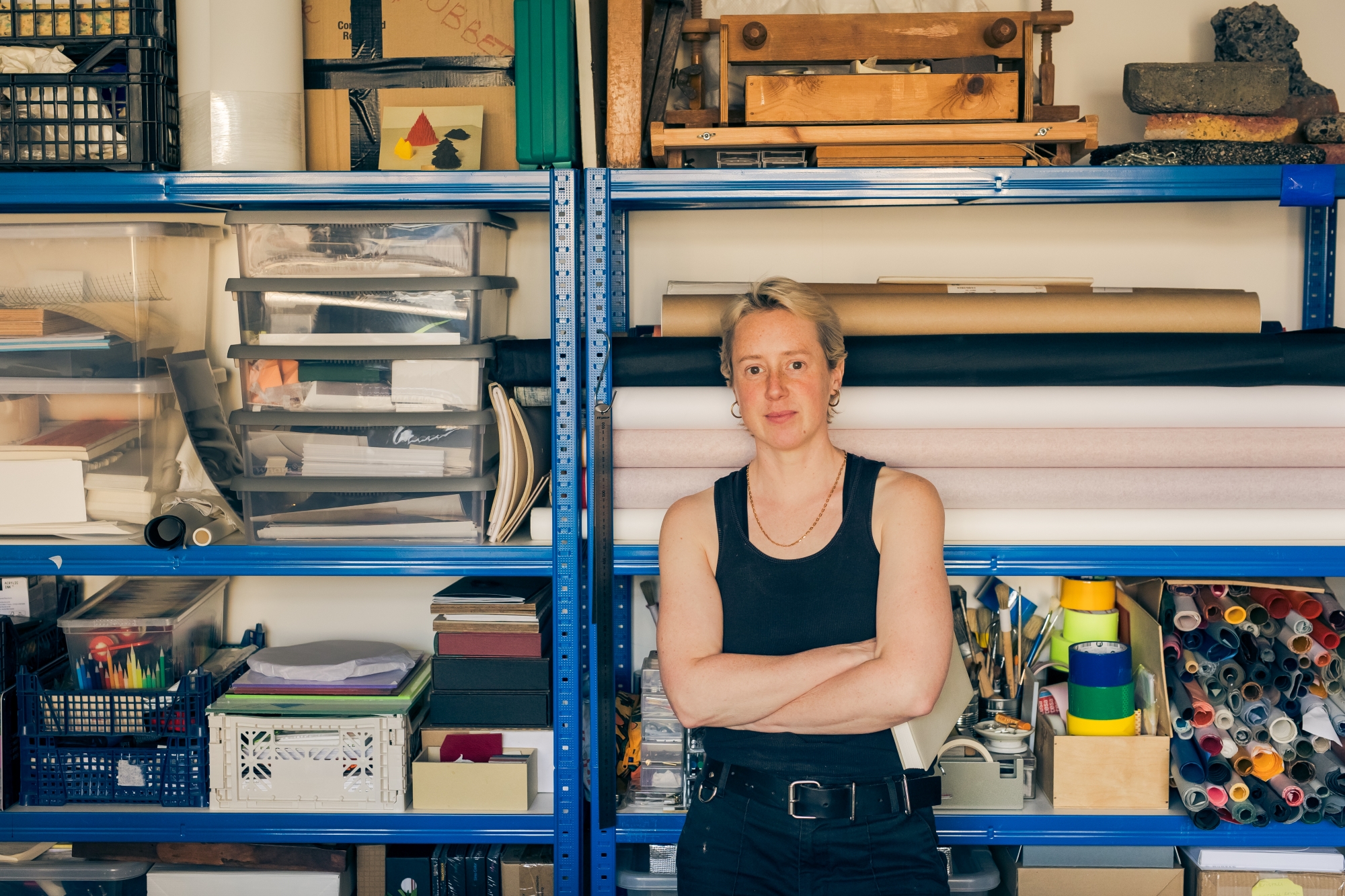 Sim Orme standing in front of some shelves