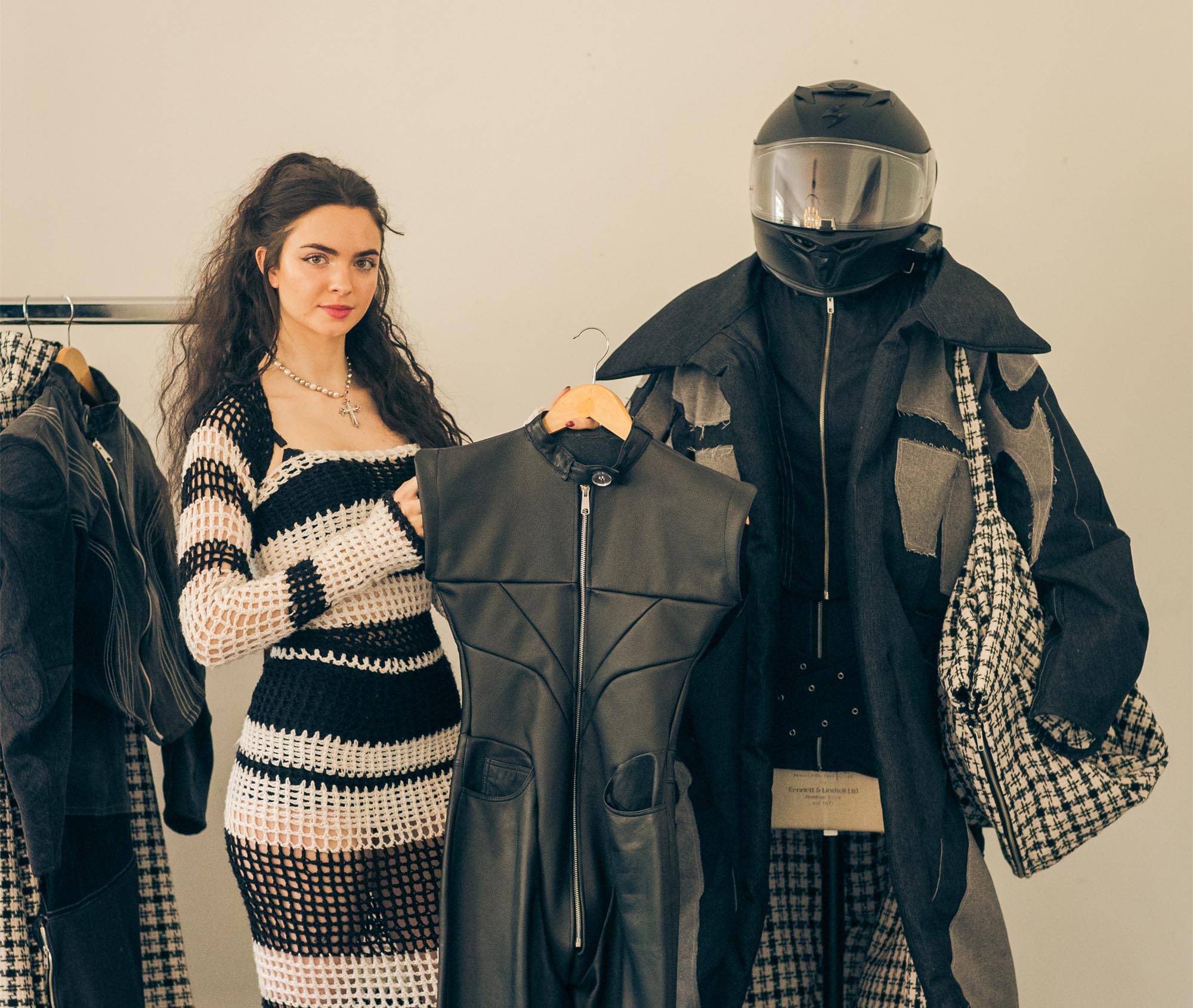 woman holding a leather jacket